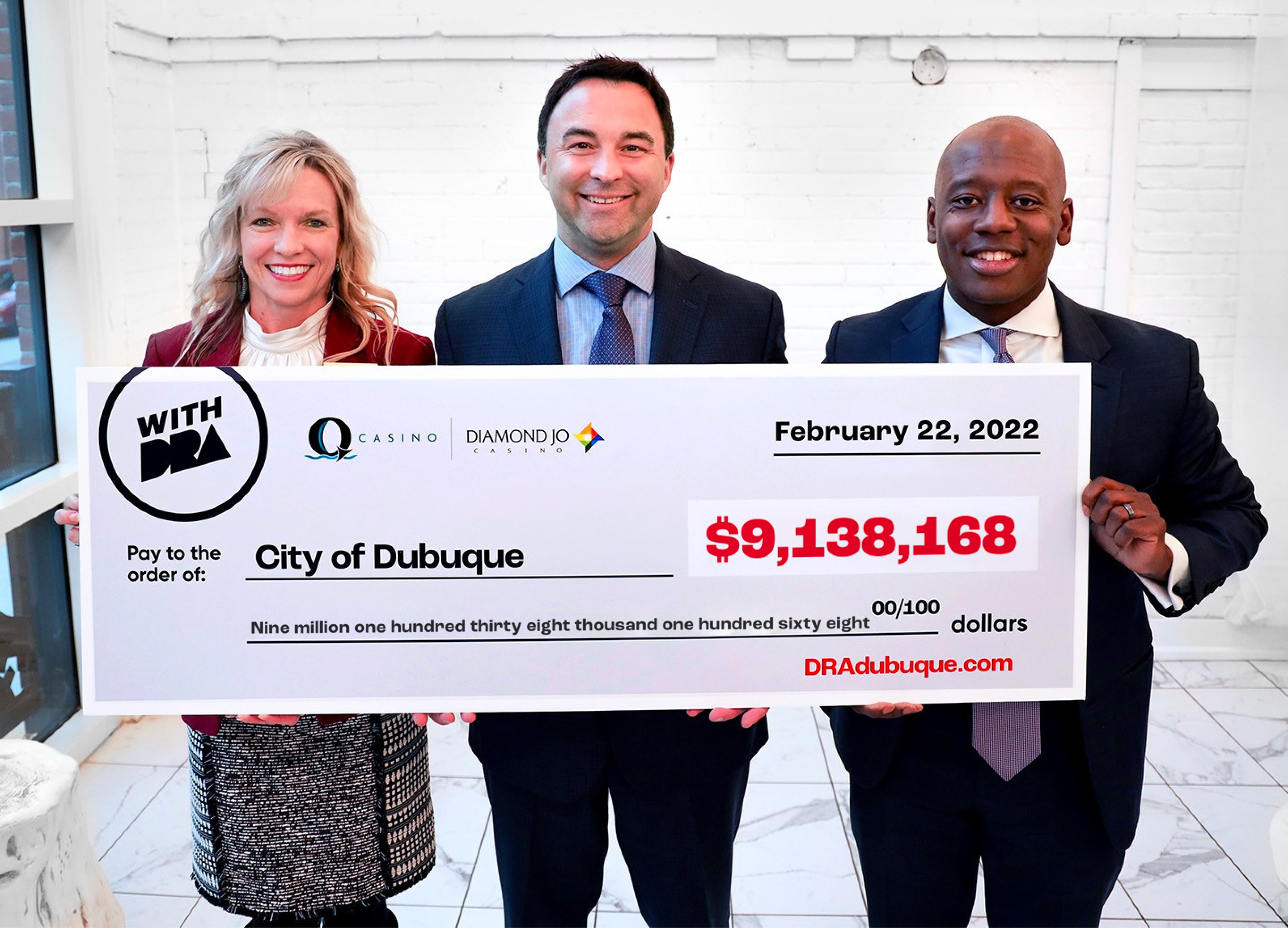 City of Dubuque and the DRA team holding a check